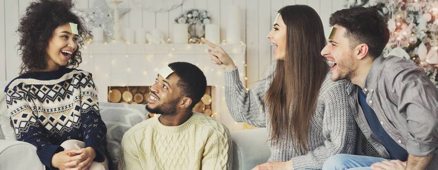 Friends around a Christmas party game