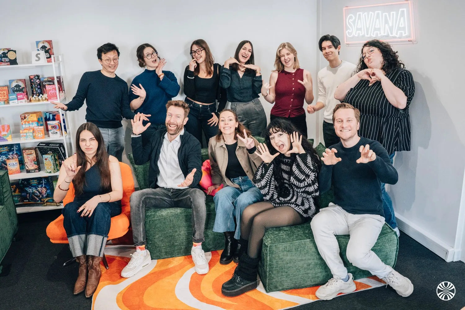 The SAVANA team together in its Paris office, under the SAVANA neon sign